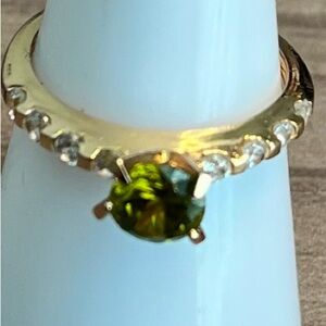 Gold Tone Ring with Green Center Stone and Accent Crystals